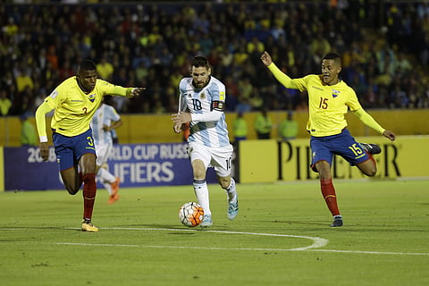 Argentina's Lionel Messi, center, fights for the ball against Ecuador's Robert Arboleda, left, and Ecuador's Jefferson Intriago during their 2018 World Cup qualifying soccer match at the Atahualpa Olympic Stadium in Quito, Ecuador, Tuesday, Oct. 10, 2017. | AP