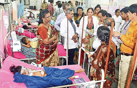 The Central expert team examining the case sheet of a dengue affected child at the Institute of Child Health in Egmore,  on Friday | D SAMPATHKUMAR