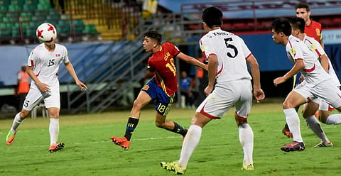Players of Guinea and Germany white vie for the ball during their U-17 FIFA World Cup football match.|PTI