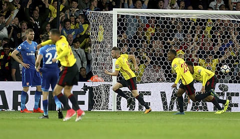 Watford's Tom Cleverley, center, celebrates scoring his side's second goal of the game during their English Premier League soccer match at Vicarage Road. | AP