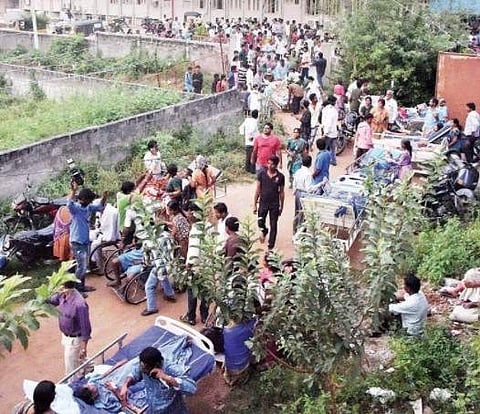 Patients being shifted by their family members out of Rohini Super Speciality Hospital, where a fire broke out, to other hospitals  in Warangal on Monday |Express photo