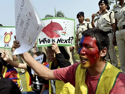 Tibetans shout slogans during a protest against Chinese President Xi Jinpin near the Chinese Embassy in New Delhi on Wednesday. (PTI)