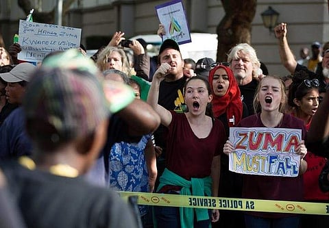 Supporters of President Zuma confront demonstrators calling for Zuma's removal outside the home of the controversial Gupta family in Johannesburg. (File photo | Reuters)