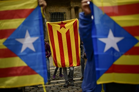 Pro independence supporters hold up ''esteleda'' or Catalan pro independence flags, in support of the Catalonia's secession referendum, in Pamplona, northern Spain on Oct. 1, 2017. (Photo | AP)