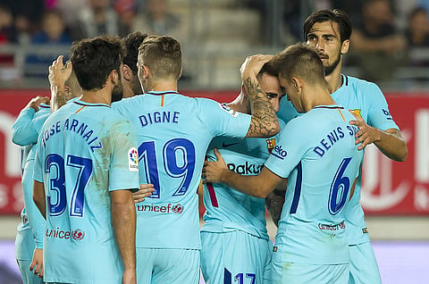Barcelona's Paco Alcacer, third right, celebrates after scoring the opening goal against Real Murcia during the Copa del Rey round of 16 first leg soccer match. | AP