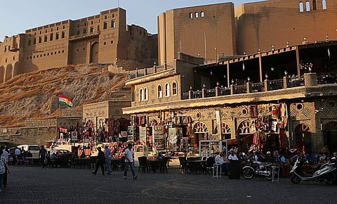 A Kurdish flag waves near almost empty souvenirs shops next to the citadel in central Irbil. (Photo | AP)