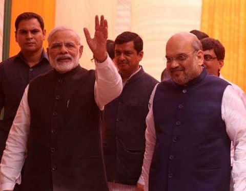 Prime Minister Narendra Modi and BJP president Amit Shah during the Diwali Mangal Milan at BJP headquarters in New Delhi on saturday. | Express photo by Shekhar Yadav