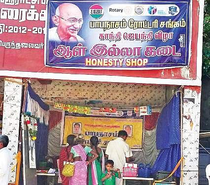 Customers at the Honesty Shop at Papanasam bus stop | Express