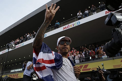 Lewis Hamilton claimed his fourth Formula One world title on Sunday and joined the elite club of the sports. (Photo: AP)
