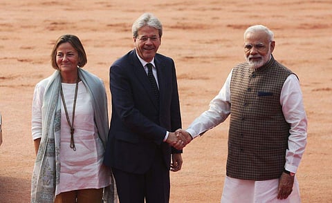 Italian Prime Minister Paolo Gentiloni shakes hands with Prime Minister Narendra Modi as he arrives for a ceremonial reception at the President's House in New Delhi on Monday. (Express photo | Shekhar Yadav)