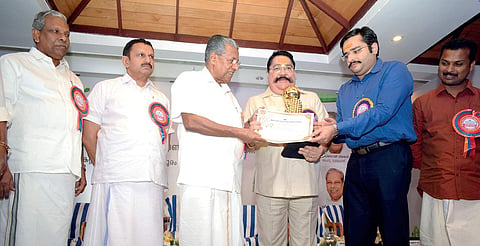 Chief Minister Pinarayi Vijayan presenting the certificate of merit for excellence in largescale industries category to Cochin Minerals and Rutile Ltd managing director  S N Sasidharan Kartha at the award distribution ceremony of Kerala State Pollution Co