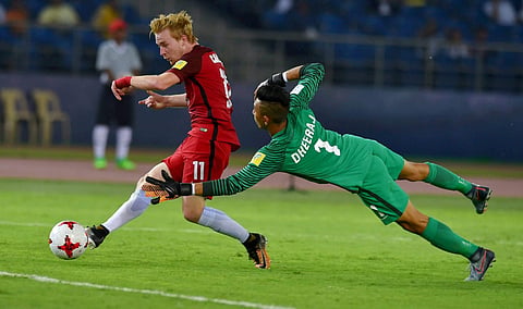 Indian goalkeeper Dheeraj fails to save as USA's Carleton scores the 3rd goal during their U-17 FIFA World cup match. (Photo | PTI)