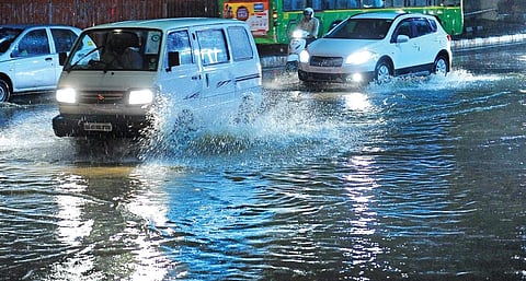 Vehicles navigating the water-logged Seshadripuram Road on Friday evening  | NAGESH POLALI