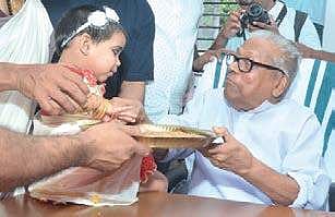 Administration Reforms Commission Chairman V S Achuthanandan initiating a child into the world of letters.