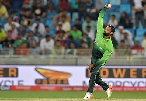 Pakistan's Muhammad Hafeez bowls during the first one day international (ODI) cricket match between Sri Lanka and Pakistan at Dubai International Stadium in Dubai on October 13, 2017. | AFP
