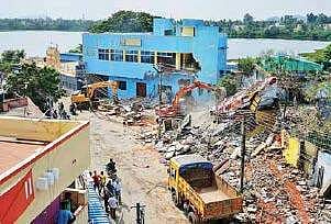 Demolition of commercial buildings on encroached land in progress at Chitlapakkam on Wednesday
