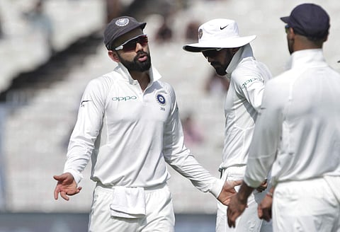 India's captain Virat Kohli reacts during the third day of their first test cricket match against Sri Lanka in Kolkata | AP