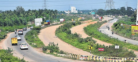 Motorists pass through narrow roads at Karanodai due to delay in widening of the Chennai-Tada NH. Sharp turns and potholes also contribute to motorists’ misery  | P Jawahar
