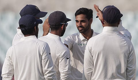 India's Bhuvneshwar Kumar (without cap) celebrates the dismissal of Sri Lanka's Lahiru Thirimanne | AP