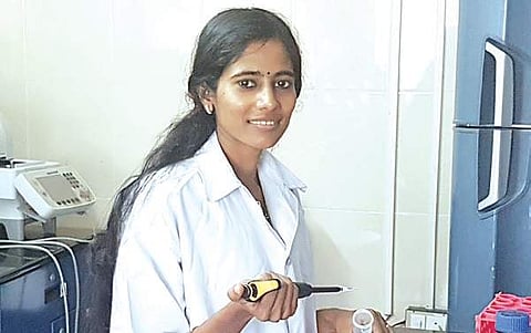 Sruthi S in her lab at Central  University of Kerala