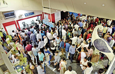 Passengers waiting to collect smart cards at  Miyapur metro station ticket counter, in Hyderabad on Wednesday  | vinay madapu