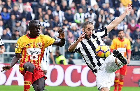 Juventus' Gonzalo Higuain, right, scores a goal during the Italian Serie A soccer match between Juventus and Benevento at the Allianz Stadium in Turin, Italy, Sunday, Nov. 5 2017.  | AP