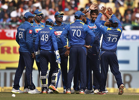 Sri Lanka's Suranga Lakmal, second right, celebrates with teammates the dismissal of India's Manish Pandey during their first one-day international cricket match in Dharmsala. | AP