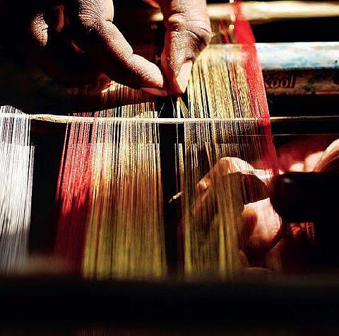 Craftsmen weave silk shawls for Telangana government in Hyderabad on Friday for World Telugu Conference | Vinay Madapu