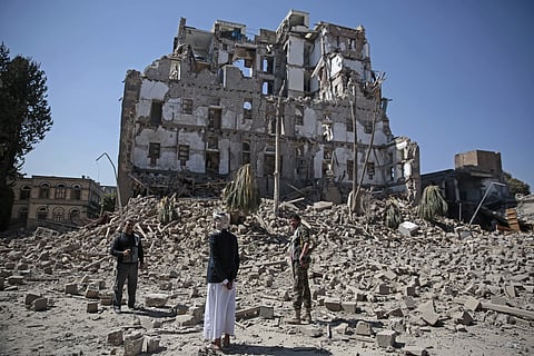 Houthi Shiite rebels inspect the rubble of the Republican Palace that was destroyed by Saudi-led airstrikes, in Sanaa, Yemen, Wednesday, Dec. 6, 2017. | AP