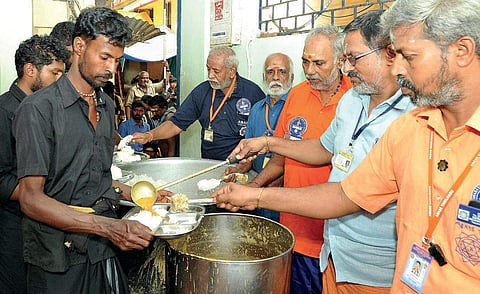Akhila Bharatha Ayyappa Seva Sangham national vice-president M Sreedhar launching the round-the-clock free food distribution for pilgrims at Sabarimala temple on Saturday | SHAJI VETTIPURAM