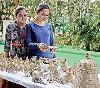 Customers buying bronze artifacts put on sale at L B Stadium in Hyderabad on Saturday  |sathya keerthi