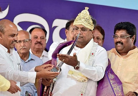Chief Minister Siddaramaiah was presented a sword by MLA Malikaiah Guttedar at Afzalpur on Saturday