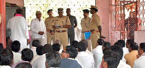 DIG Y Nagi Reddy and other officials interacting with Adivasis and Lambadas,  in Adilabad on Wednesday  | Express