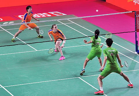 Prajakta Sawant and Shin Baek Cheol of North Eastern Warriors (green) action against Kamilla Rytter Juhl and Lee Chun Hej Reginald Verma of Ahemadabad Smash Masters in the mixed doubles event | PTI