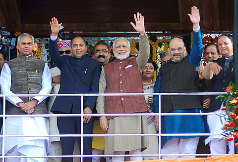 Prime Minister Narendra Modi with New Chief Minister of Himachal Pradesh Jairam Thakur BJP president Amit Shah and Governor of Himachal Pardesh Acharya Devvrat after the swearing-in ceremony in Shimla on Wednesday. | PTI