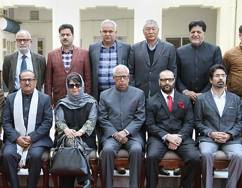 Jammu and Kashmir Governor N N Vohra, Chief Minister Mehbooba Mufti, Tassaduq Hussain Mufti, MLA Chadoora Javaid Mustafa Mir and other cabinet ministers pose for a group photograph after the swearing-in ceremony of the newly inducted ministers at Raj Bhav