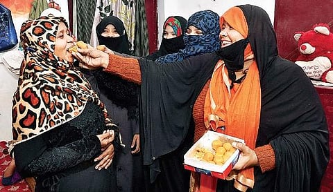 Muslim women celebrate the passage of the Triple Talaq Bill in the Lok Sabha, in Lucknow on Thursday | PTI