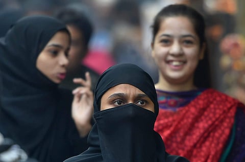 Muslim girls and women at a market in the walled city area of Delhi on Thursday.  | PTI