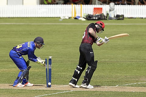 New Zealand-born England cricket player Ben Stokes is bowled for 2 runs by Amaru Kitchen as wicketkeeper Derek de Boorder looks on during provincial cricket team Canterbury in Rangiora, New Zealand, Sunday, Dec. 3, 2017. | AP