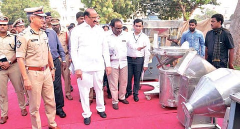 Health Minister Kamineni Srinivas and Police Commisioner Gautam Sawang take a look at the seized drug manufacturing equipment at the Police Command Control  Centre in Vijayawada on Monday;