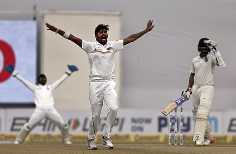 Sri Lanka's Suranga Lakmal, center, appeals for the dismissal of India's Ajinkya Rahane, right, during the fourth day of their third Test match in New Delhi, India, Tuesday, Dec. 5, 2017. | AP