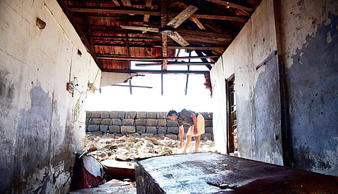 Prasad, a native of Nayarambalam, at a  house damaged in the cyclone Ockhi. Even after 9 days, people are yet to return to their homes | Albin Mathew