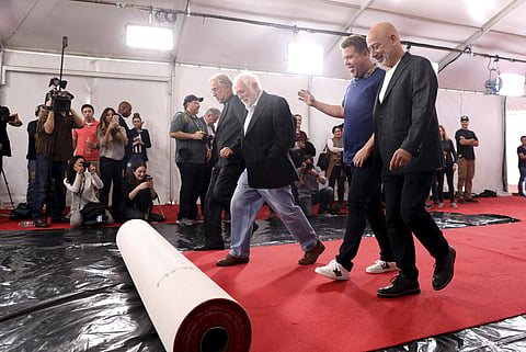 Neil Portnow, president of the Recording Academy, executive producer Ken Erhlich, host James Corden, and Jack Sussman, CBS Executive Vice President, Specials, Music, and Live Events, right, roll out the red carpet for the 59th Annual Grammy Awards inside 
