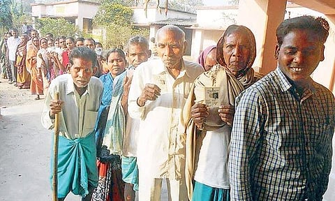 Voters queue outside a polling booth in Rengali of Sambalpur district  | Express Photo Service