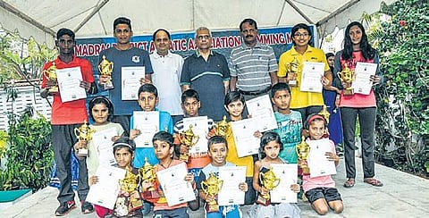 Individual champions of the 27th MDAA swimming meet with their trophies