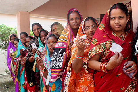 Voters wait in a queue to exercise their franchise during the 3rd phase of Odisha’s Panchayat election in Kantapada village in Cuttack on Friday. | PTI File Photo