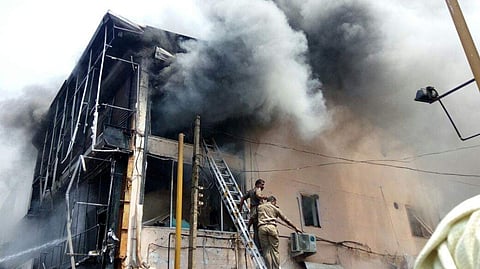 A glimpse of the rising smoke from one of the shops on SM street where the fire broke out. (EPS | A Sanesh)