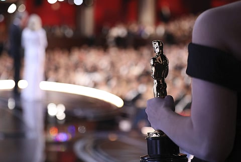 And the red carpet goes to... the women in red, for one, with equal accolades for shiny and shimmery gold worthy of the Oscars, this and all years. Long sleeves and belts played major roles Sunday in Los Angeles at the Dolby Theatre, along with a beautifu