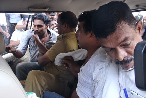 Police have taken Pulsar Suni(second from right) to the police club in Aluva.( Melton Antony | EPS)