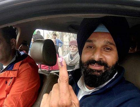 Shiromani Akali Dal SAD candidate Bikram Singh Majithia leaves after casting his vote for Assembly polls at a polling station at Majitha in Amritsar on Saturday. | PTI